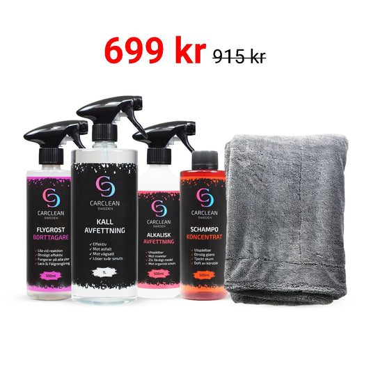 Bild på ett komplett rengöringspaket från CarClean CC som innehåller produkter för effektiv bilvård. Paketet inkluderar flygrostborttagare, kallavfettning, alkalisk avfettning, schampokoncentrat och en grå mikrofiberduk, presenterat på en ren bakgrund.
